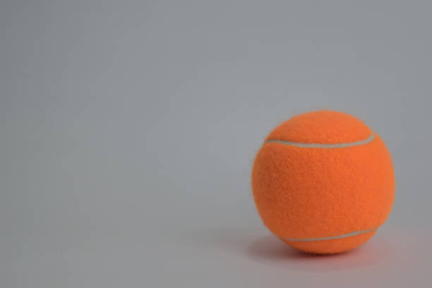 istock Close up tennis ball isolated on white background 1145783523
