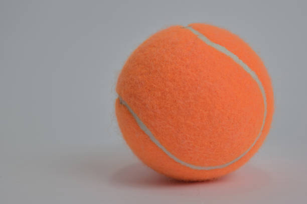 istock Close up tennis ball isolated on white background 1145783524