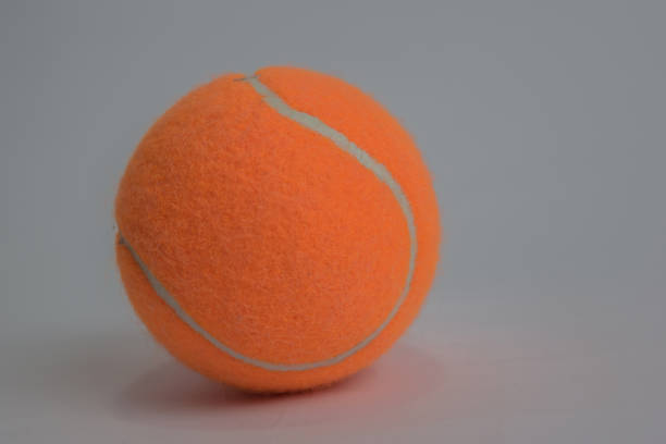 istock Close up tennis ball isolated on white background 1145783529