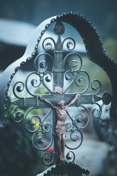 istock Iron crucifix in cemetery, Jesus 1145785108