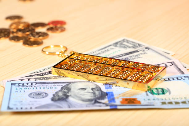 istock Gold abacus and the dollar 1145786140