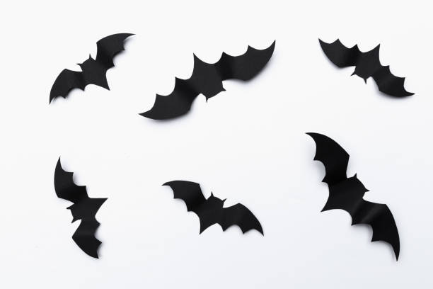 istock halloween and decoration concept - paper bats flying 1145788138