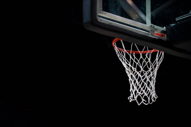 istock Low Angle View Of Basketball Hoop At Night 1145789093