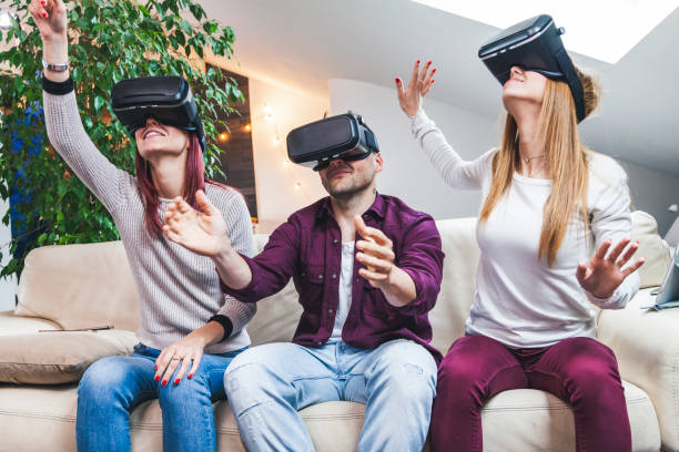istock Young happy three friends playing video games 1145789350