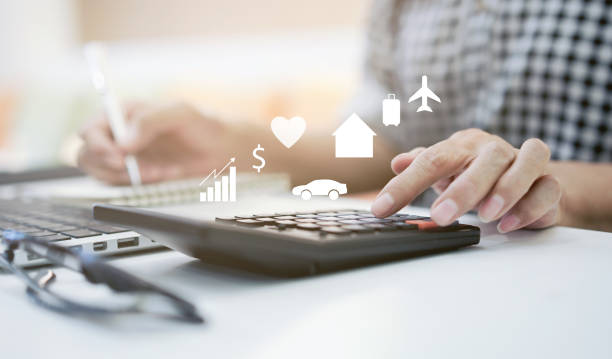 close up on mature woman pressing on calculator for making expense monthly and manage spending of life when retire such as home loan,insurance,savings,travel,health , lifestyle aged people concept close up on mature woman pressing on calculator for making expense monthly and manage spending of life when retire such as home loan,insurance,savings,travel,health , lifestyle aged people concept travel refund stock pictures, royalty-free photos & images