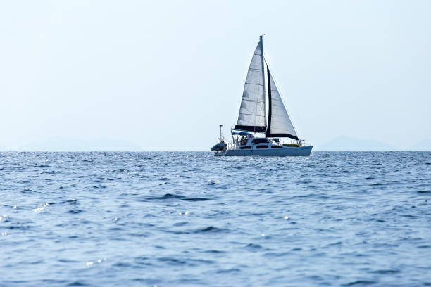 istock Sailing ship luxury yacht with white sails in the Sea. 1145801079
