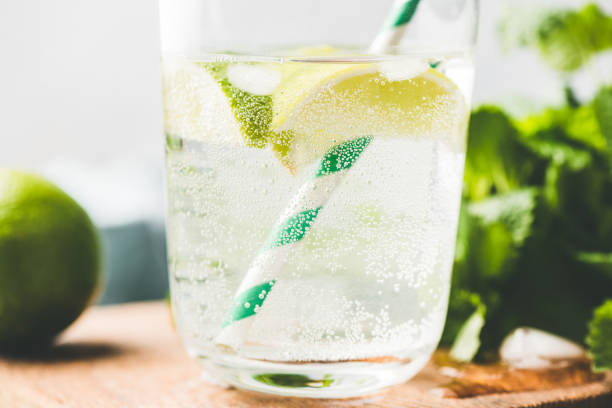 Closeup view of sparkling lemonade or lemon soda Closeup view of sparkling lemonade or lemon soda in glass, cold summer drink carbonated stock pictures, royalty-free photos & images