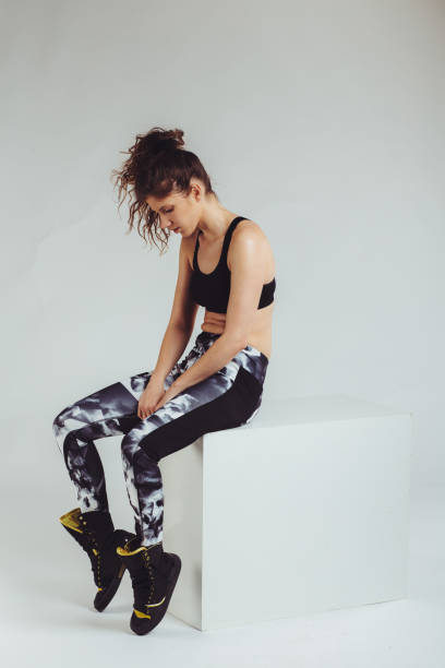 istock Young fitness woman posing at the studio 1145802406