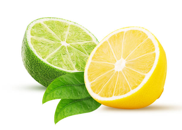 istock Fresh lime, lemon cut in half, with leaf isolated on white 1145802605