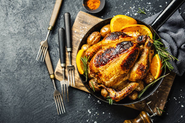 istock Baked whole chicken with spices on pan 1145802660