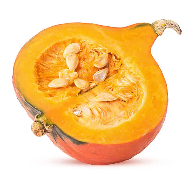 Fresh red hokkaido pumpkin cut in half isolated on white background. Clipping Path. Full depth of field.