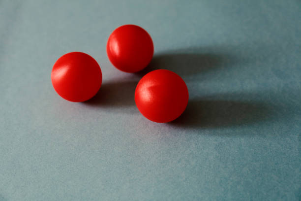 istock Red tennis ball on a green background 1145806977