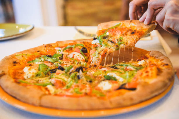 istock Taking slice from vegetarian pizza from Greece 1145812154
