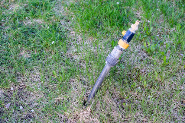 istock Garden Hose Nozzle Sprayer in the background 1145812514