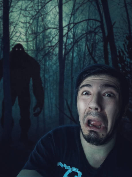 istock Man scared by King-Kong in dark forest 1145812527