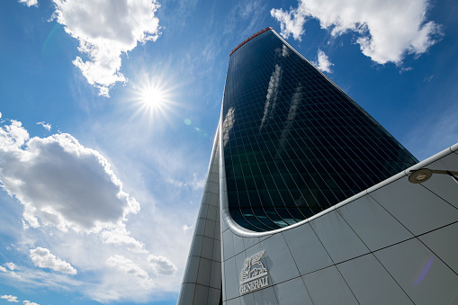 Milan, Italy - April 28, 2019: The modern architecture of the new City Life area. The area consists in a large park with a shopping district and three towers skyscrapers: the Hadid Tower (or Generali Tower), the Isozaki Tower (or Allianz Tower) and the Libeskind Tower (not yet completed).