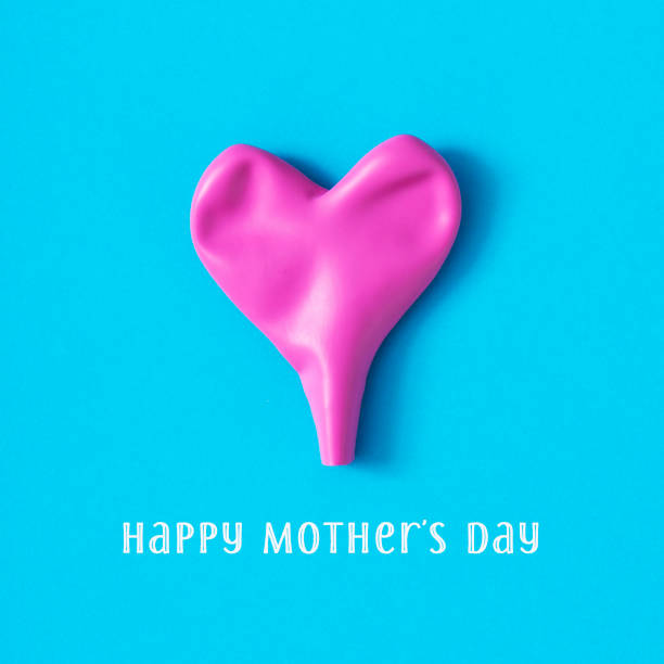 a deflated pink heart-shaped balloon and the text happy mothers day on a blue background