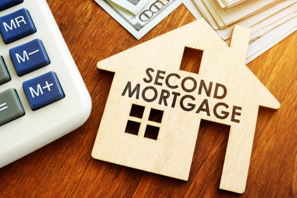 istock Second Mortgage written on wooden home. 1145828900