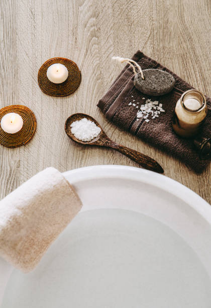 istock Magnesium Chloride vitamin salt in foot bath water, solution. Magnesium grains in foot bath water are ideal for replenishing the body with this essential mineral, promoting overall well being. 1145831042