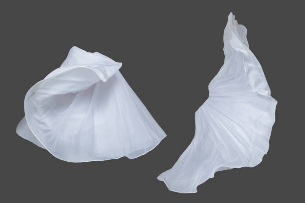 istock Set of white fluttering silk textile over dark gray background 1145832635