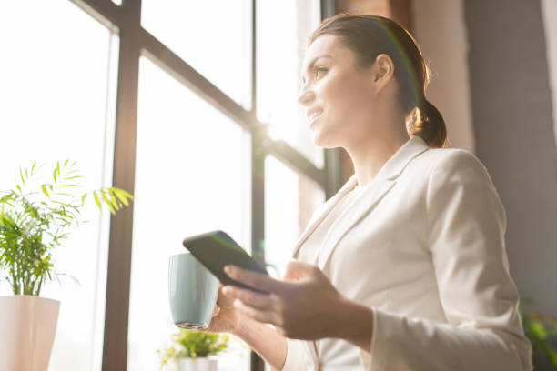 istock Businesswoman by window 1145832706