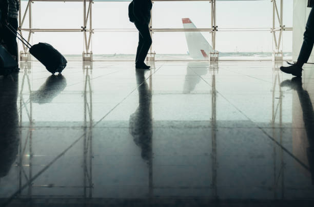 istock Airport with passenger silhouettes 1145832735