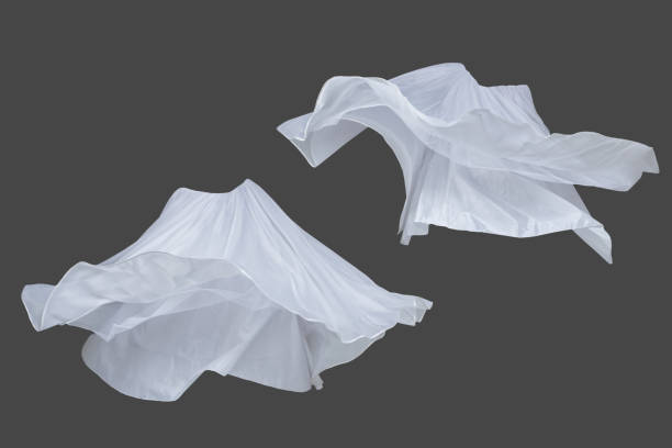 istock Set of white fluttering silk textile over dark gray background 1145832889