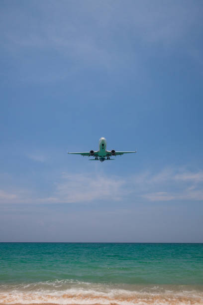 istock airplane landing close to the beach 1145833075