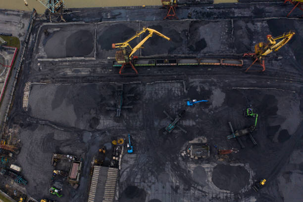 istock Sea port cranes loading coal. Aerial drone shot 1145834064