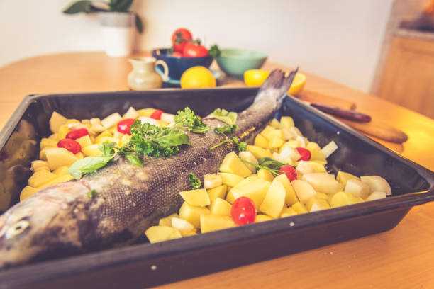 Mediterranean cousin; Raw fish and potatoes ready for the oven