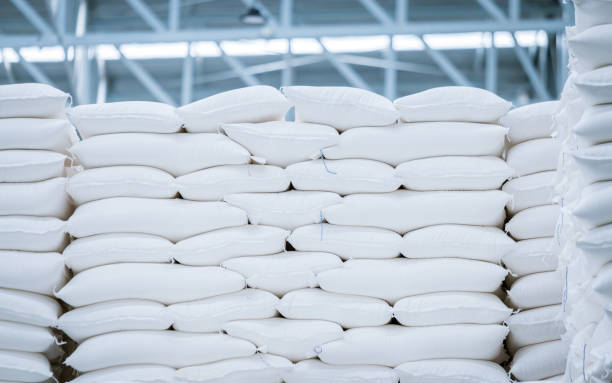 stack of white bag in the warehouse stack of white bag in the warehouse rice sack stock pictures, royalty-free photos & images