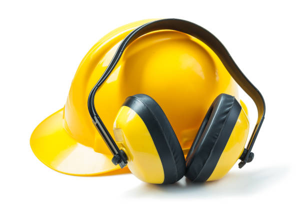 istock yellow head phones and helmet isolated 1145838707