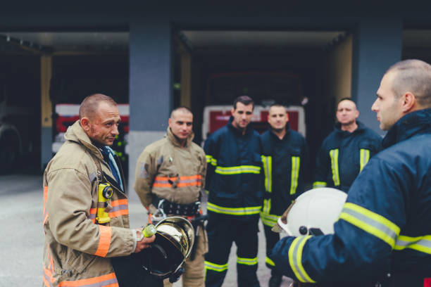 istock Team of firefighters listening to instructions 1145838913