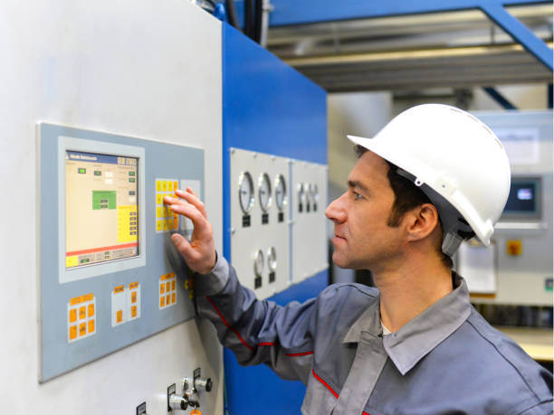 istock industrial workers inspect the technology of a plant for function - assembler in working clothes 1145840626
