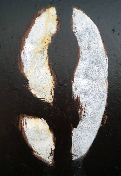 istock Number 9 in stencil on dark brown metal wall. 1145842215