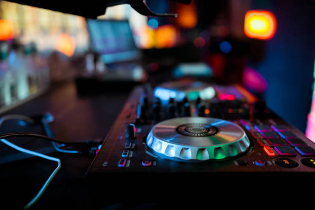 istock DJ mixing music on console at the night club 1145843516