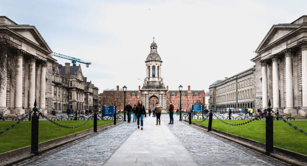 People walking in the courtyard of Trinity College in Dublin, Ireland Dublin, Ireland - February 11, 2019: People walking in the courtyard of Trinity College in the city center on a winter day hull house stock pictures, royalty-free photos & images