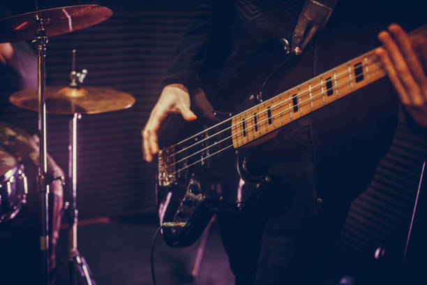 istock Man bass guitarist playing electrical guitar 1145847845