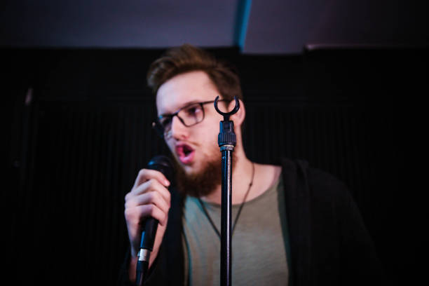 istock Man singing song with microphone 1145847928