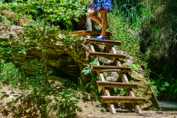 Young woman walking in canyon.