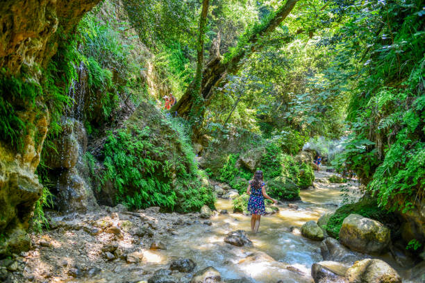 Young woman walking in canyon.