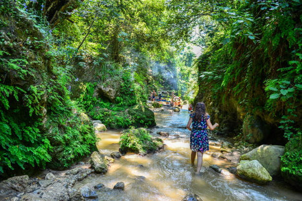 istock Young woman walking in canyon. 1145850593