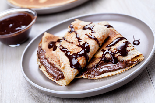 Couple of homemade crepes with some chocolate