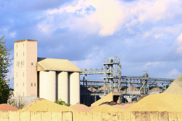 istock Industrial area with metal structures and piles of construction sand 1145852965