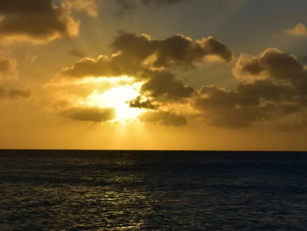 Aruba's beautiful orange sunset over the ocean.