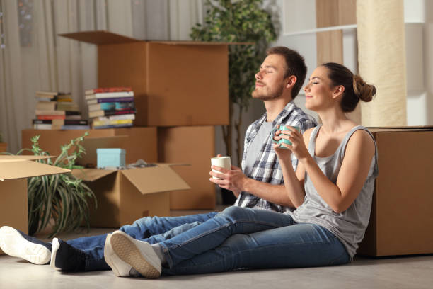 istock Happy couple moving home resting breathing fresh air 1145855942