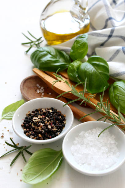 istock Woodenspoon and knife with ingredients on white background. 1145855963