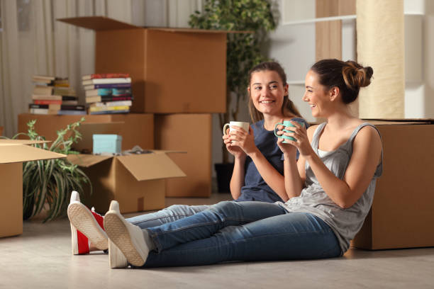 Happy roommates moving home resting and talking Happy roommates moving home resting and talking male friendship stock pictures, royalty-free photos & images