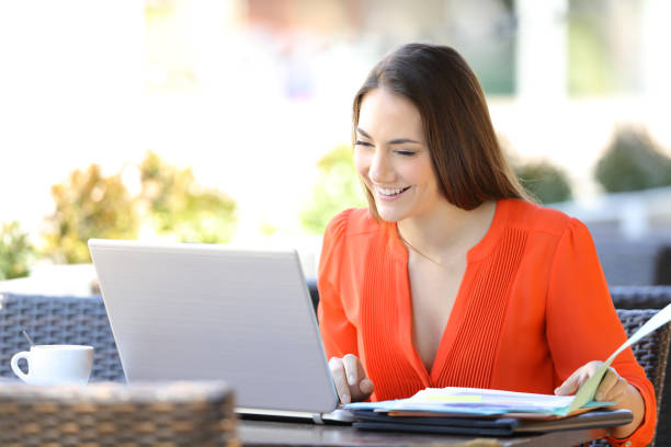 istock Happy entrepreneur working online in a coffee shop 1145856281