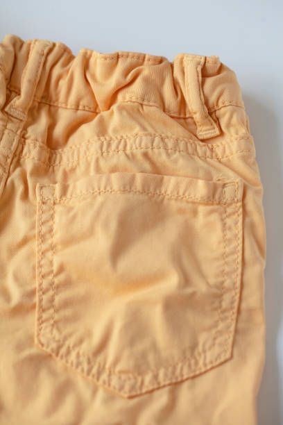 istock Back pocket of neon orange jeans pants 1145857349